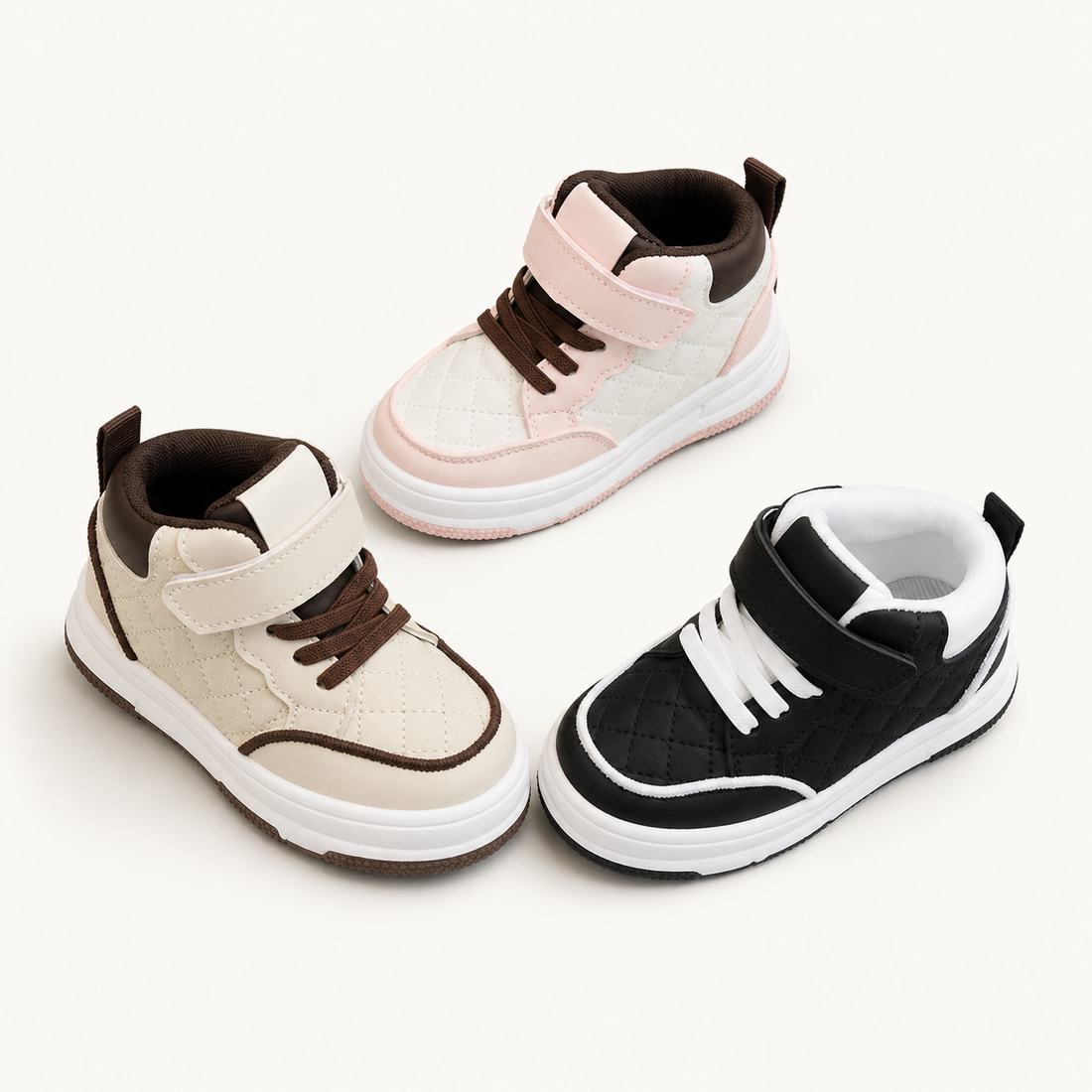 Set of three children’s high-top sneakers in black, khaki, and pink