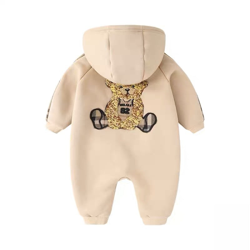 Beige fleece-lined newborn hooded onesie with bear applique and plaid sleeve cuffs